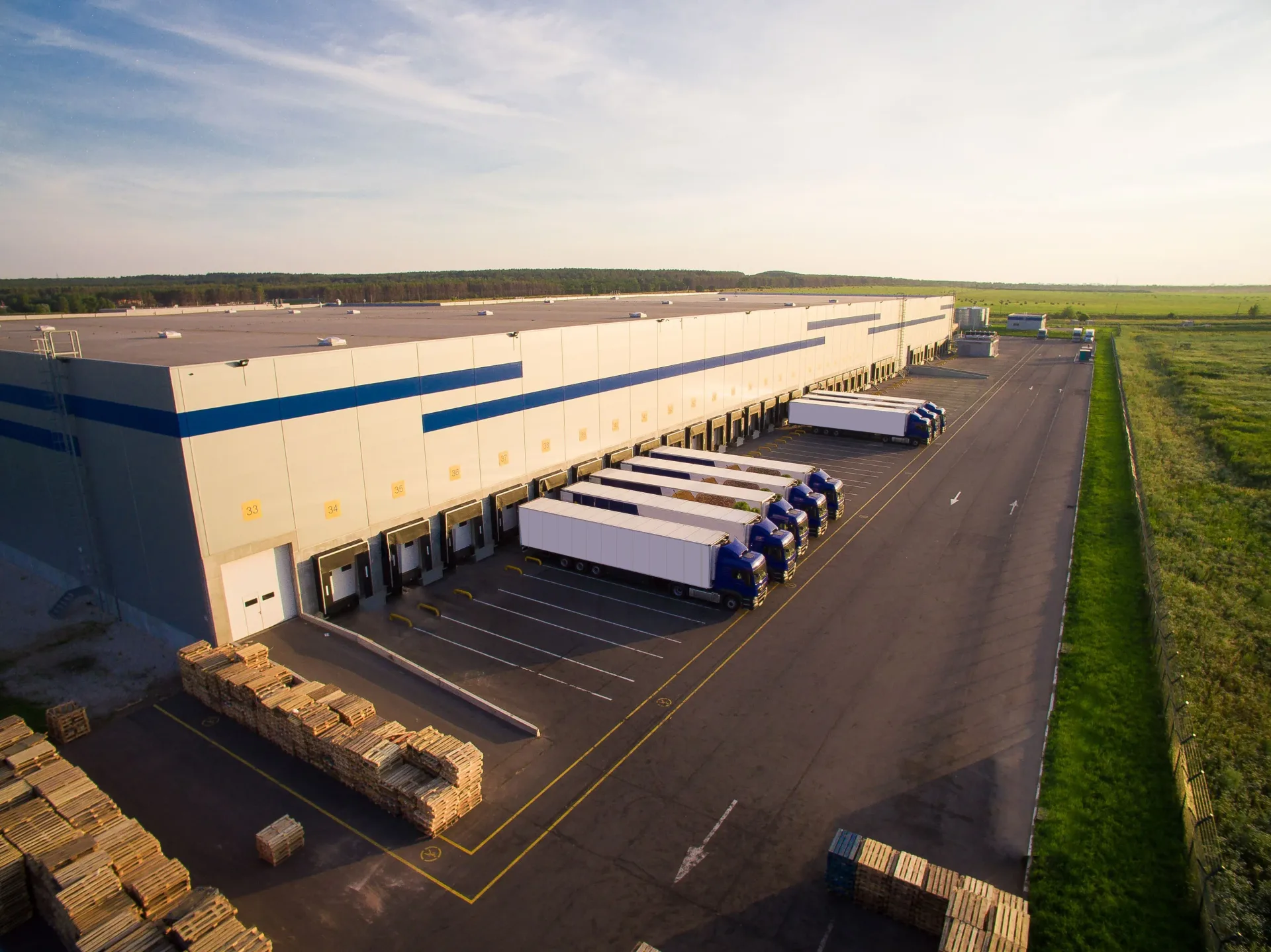 Trucks docked at a distribution warehouse